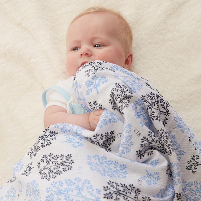 Little Turtle Baby - Stretch Muslin Swaddle - Blue Leaves