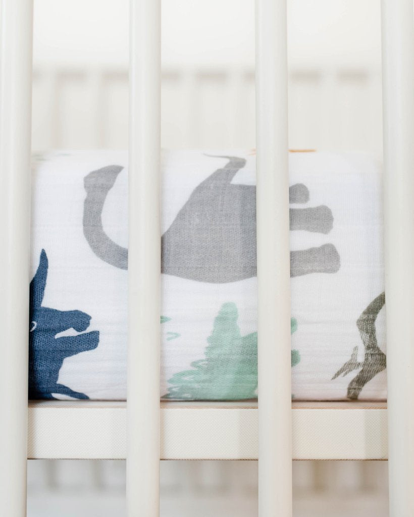 Little Unicorn - Cotton Muslin Cot Sheet - Dino Friends