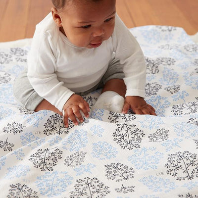 Little Turtle Baby - Stretch Muslin Swaddle - Blue Leaves