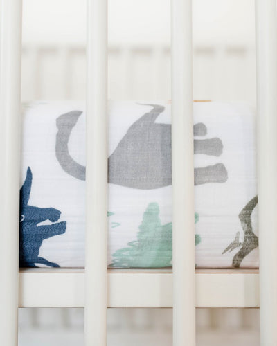 Little Unicorn - Cotton Muslin Cot Sheet - Dino Friends